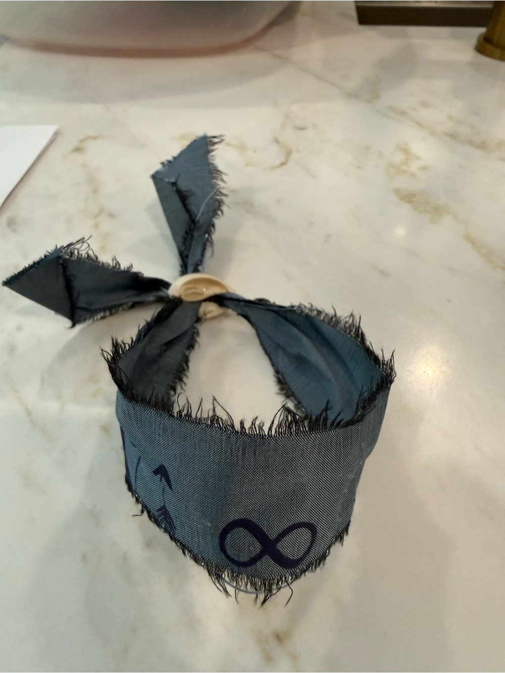 Frayed Adjustable Fabric Infinity Symbol Bracelet with shell closure